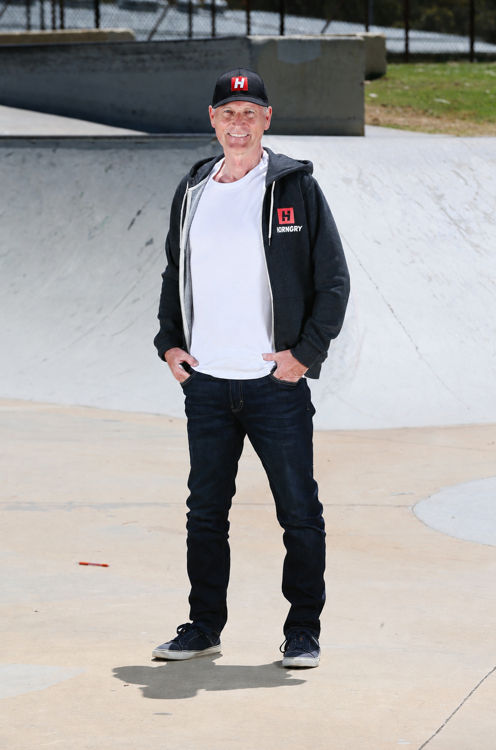 Brian Smithies, HORNGRY founder, standing in a skatepark bowl